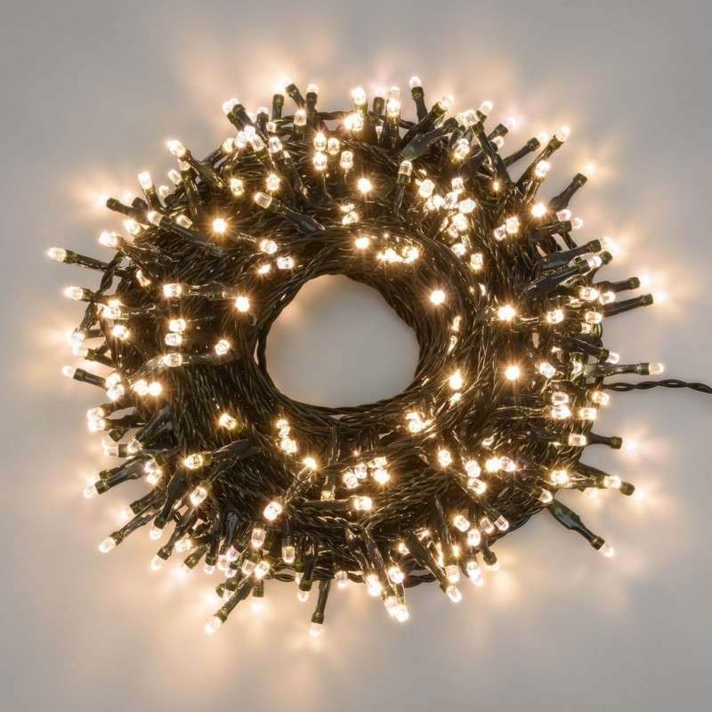 String of 100 warm white connectable LED lights, 6.5 meters long, fixed light, green cable.