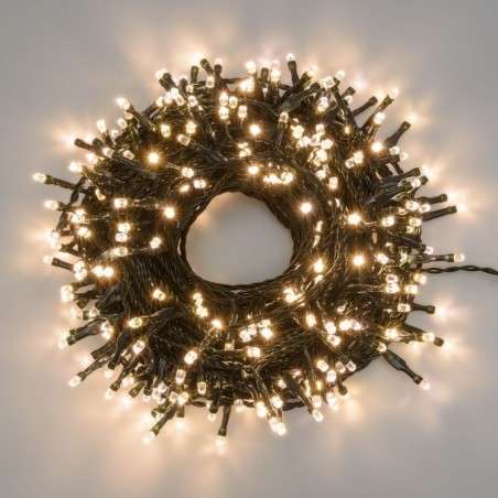 String of 100 warm white connectable LED lights, 6.5 meters long, fixed light, green cable.