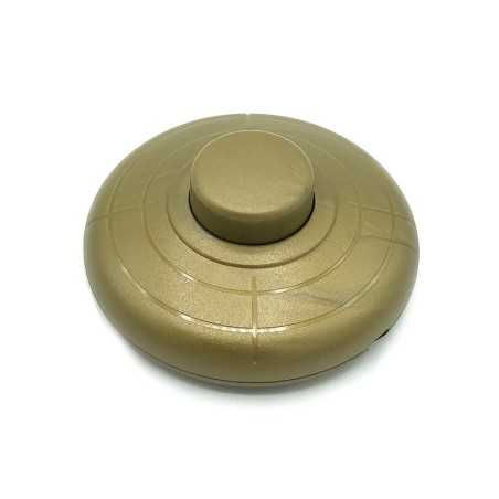 Foot-operated switch in gold color for lamps