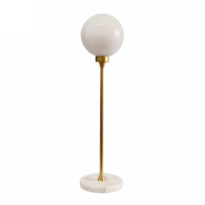 Table lamp with marble base and glass globe