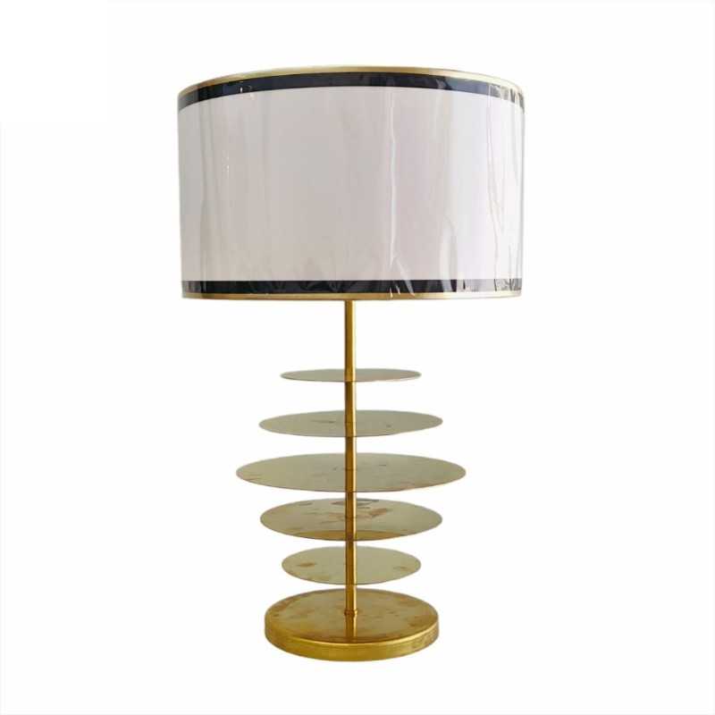 Table lamp with brass discs and textile shade