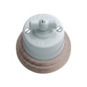 Porcelain switch with natural wood base and porcelain loop.