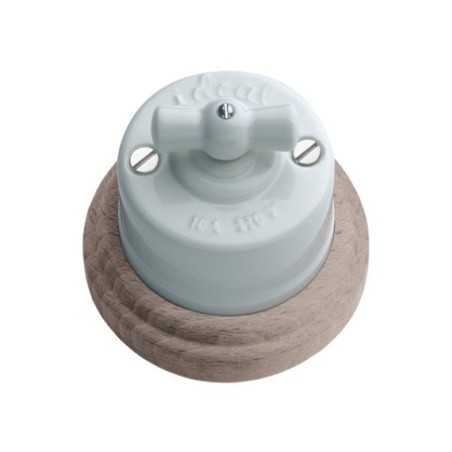 Porcelain switch with natural wood base and porcelain loop.