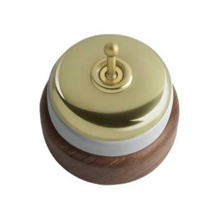 Porcelain switch with dark wood base and golden cover