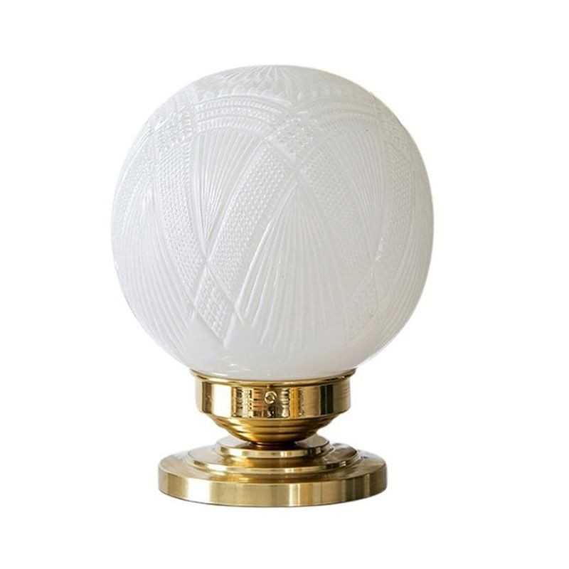 Brass table lamp with glass globe
